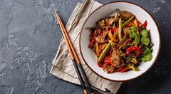 Bowl of oyster sauce stir-fry noodles with chopsticks