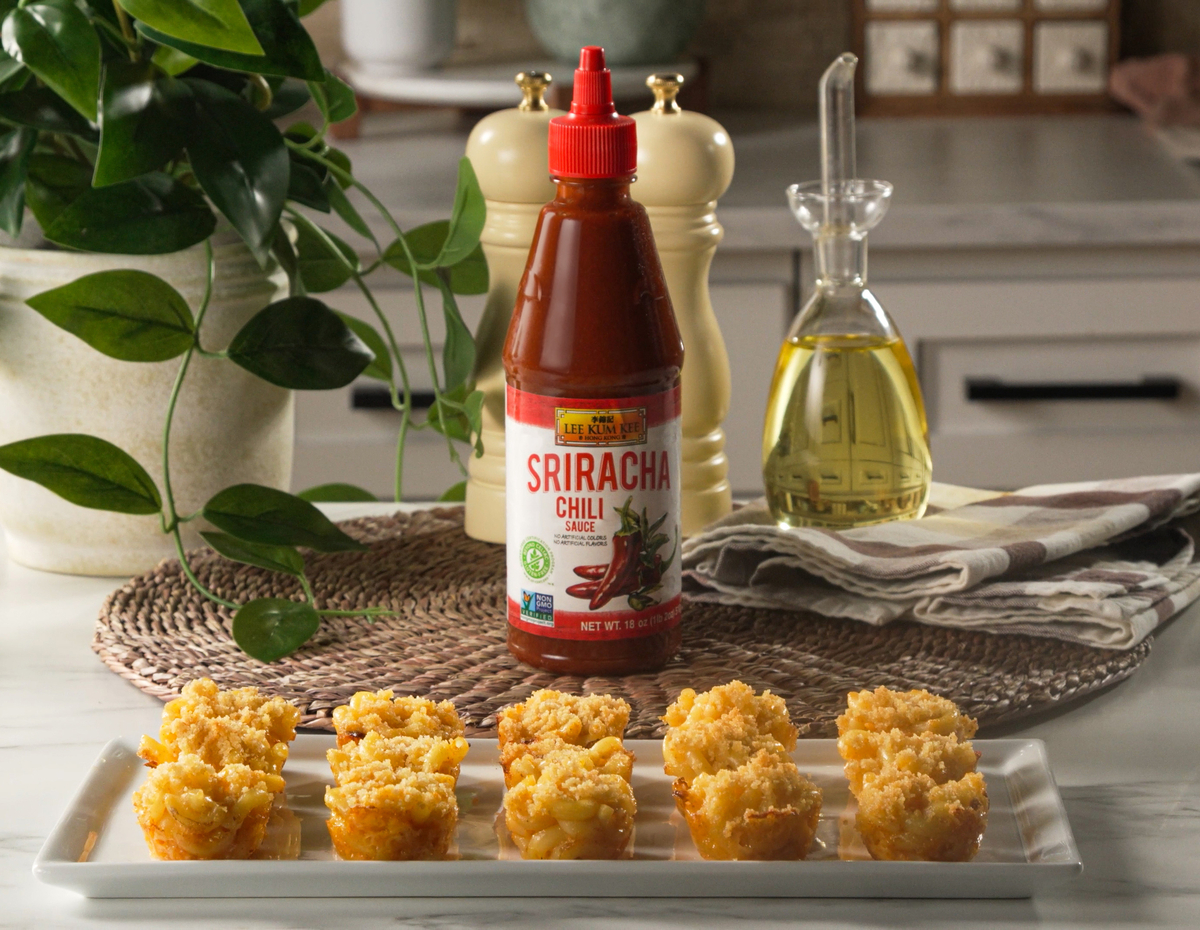 A baked mac and cheese bites recipe topped with Lee Kum Kee Sriracha.