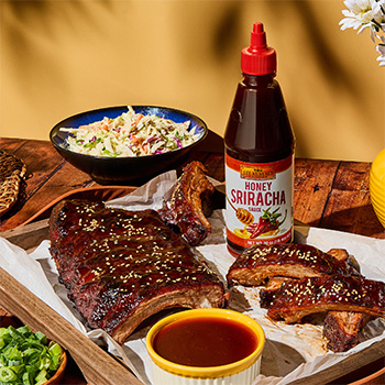 A bbq ribs recipe coated in a hot honey glaze made with Honey Sriracha.