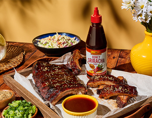 A bbq ribs recipe coated in a hot honey glaze made with Honey Sriracha.