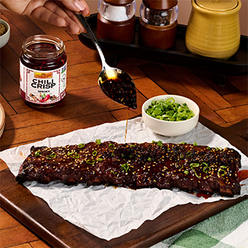 A BBQ ribs recipe finished with a smoky chili crisp glaze.