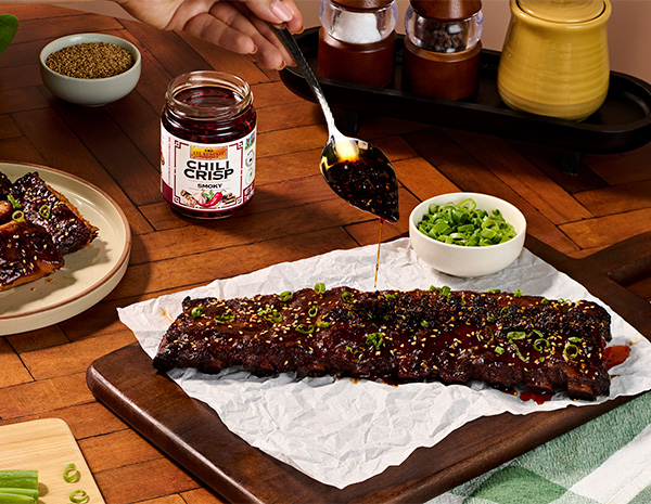 A BBQ ribs recipe finished with a smoky chili crisp glaze.
