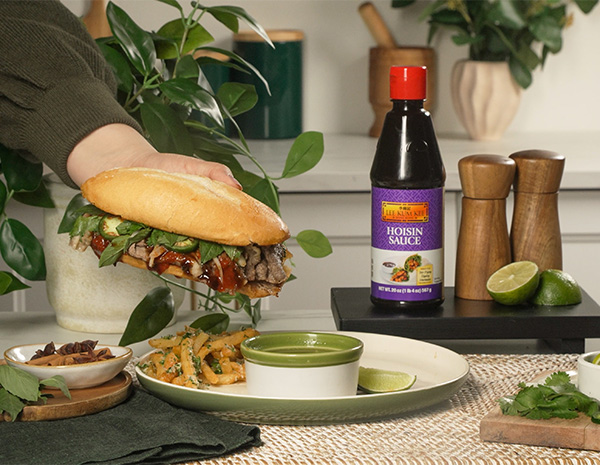 A beef pho dip sandwich recipe with pho broth au jus and Parmesan fries.