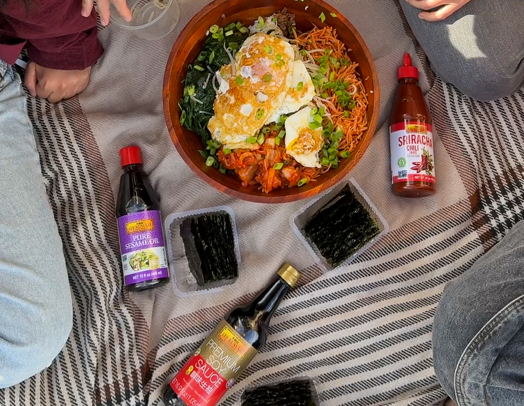 A bibimbap picnic meal with friends featuring Lee Kum Kee Sauces.