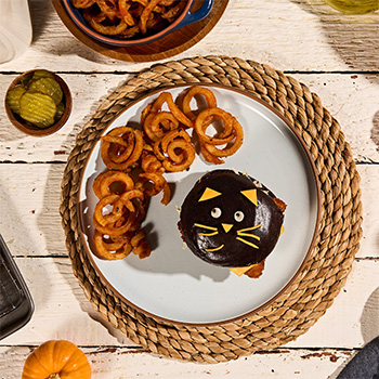 A fried fish sandwich recipe shaped like a black cat for Halloween.