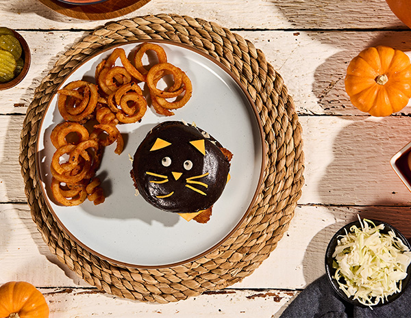 A fried fish sandwich recipe shaped like a black cat for Halloween.