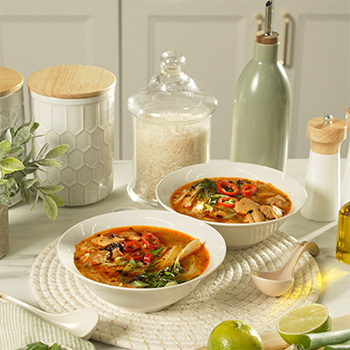 A brothy rice recipe with spicy chicken and chili crisp oil.