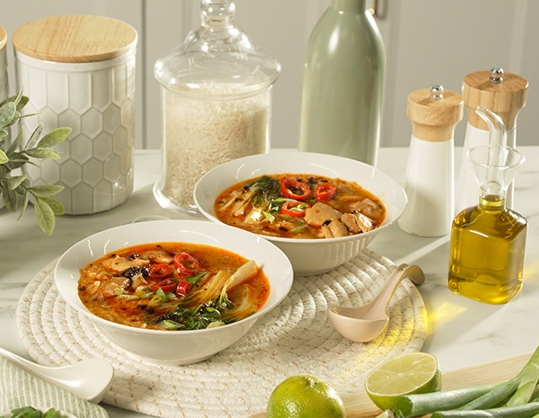 A brothy rice recipe with spicy chicken and chili crisp oil.