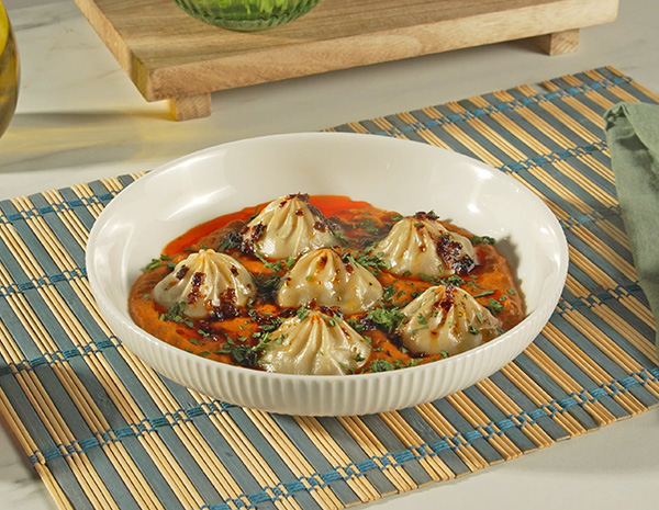 A butter chicken dumplings recipe made with Lee Kum Kee sauces.