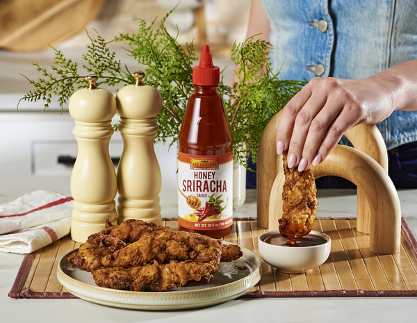 a buttermilk chicken tenders recipe with Lee Kum Kee Honey Sriracha for dipping.