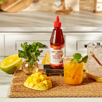 A bourbon smash cocktail recipe made with Lee Kum Kee Honey Sriracha.