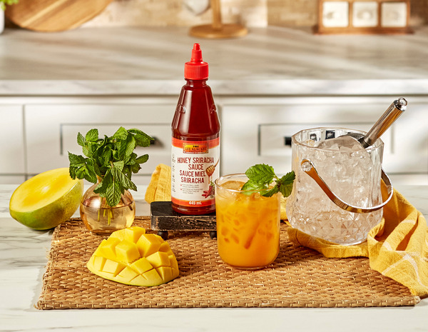 A bourbon smash cocktail recipe made with Lee Kum Kee Honey Sriracha.