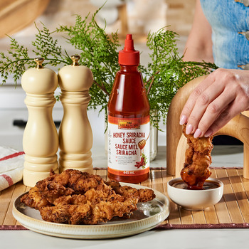 a buttermilk chicken tenders recipe with Lee Kum Kee Honey Sriracha for dipping.