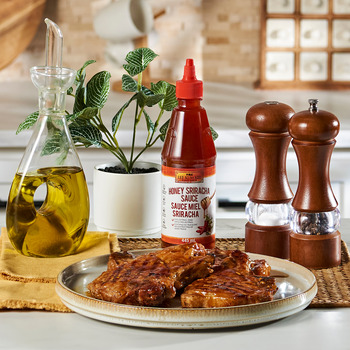 A honey sriracha pork chops recipe with Lee Kum Kee Honey Sriracha.