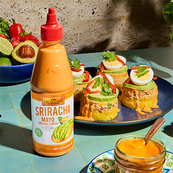 A Peruvian recipe for Causa de Mariscos made with Sriracha Mayo.
