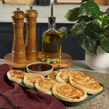 A Hotteok recipe infused with breakfast flavors like bacon, cheese, and honey sriracha.