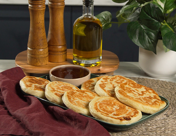 A Hotteok recipe infused with breakfast flavors like bacon, cheese, and honey sriracha.