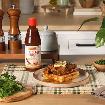 A chicken and waffles recipe with Chili Crisp Hot Honey.