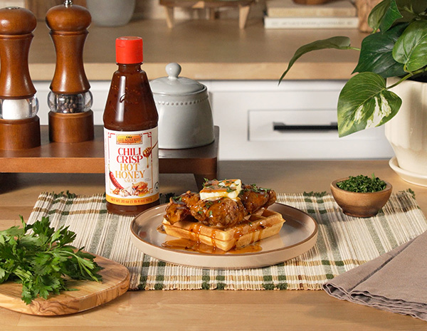 A chicken and waffles recipe with Chili Crisp Hot Honey.