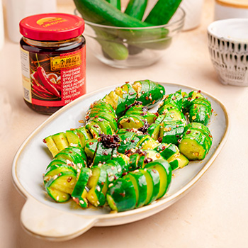 A spiral cucumber salad recipe made with Lee Kum Kee chili crisp.