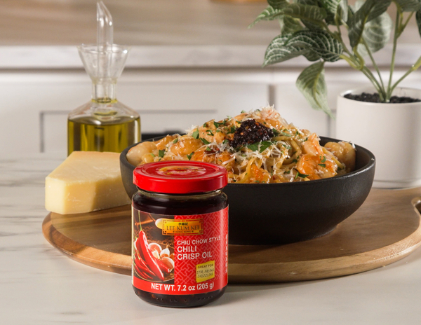 A recipe of the creamy viral Chili Oil Caramelized Onion Pasta topped with shrimp and Lee Kum Kee Chiu Chow Style Chili Crisp Oil.