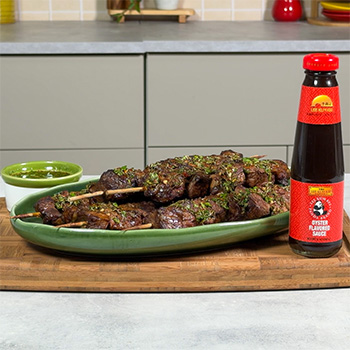 A churrasco skewers recipe, marinated in oyster sauce, served with a chimichurri sauce