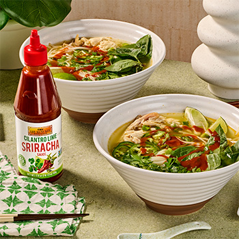 A chicken pho recipe served with Cilantro Lime Sriracha.