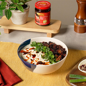 A creamy mapo tofu udon recipe topped with Chili Crisp Oil.