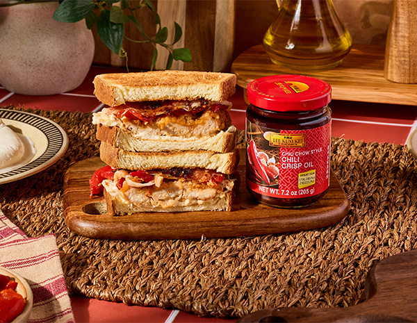 A crispy chicken cutlet sandwich recipe topped with Lee Kum Kee Chiu Chow Style Chili Crisp Oil.