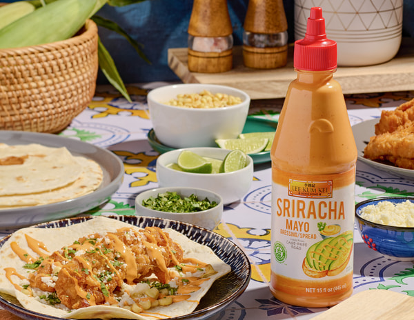 A crispy chicken tacos recipe with street corn salad made with Lee Kum Kee sriracha sauces.