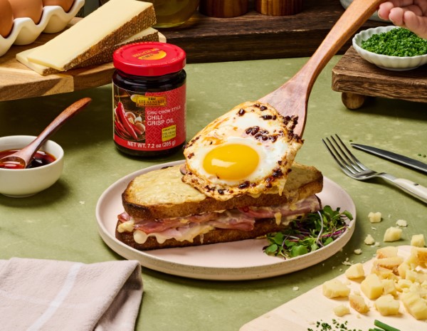 A croque madame recipe topped with a Lee Kum Kee chili crisp egg.
