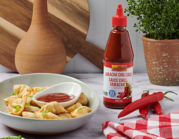 A crab rangoon recipe perfect for the air fryer with Lee Kum Kee Sriracha for dipping.