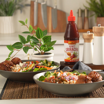 An easy falafel recipe over a brown rice bowl with honey sriracha