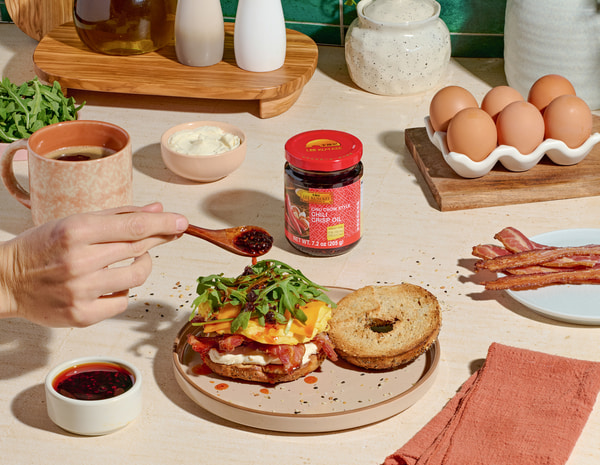 A breakfast bagel sandwich recipe with Lee Kum Kee Chili Crisp.