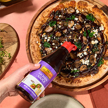 A caramelized onion pizza recipe topped with feta cheese and hoisin sauce.