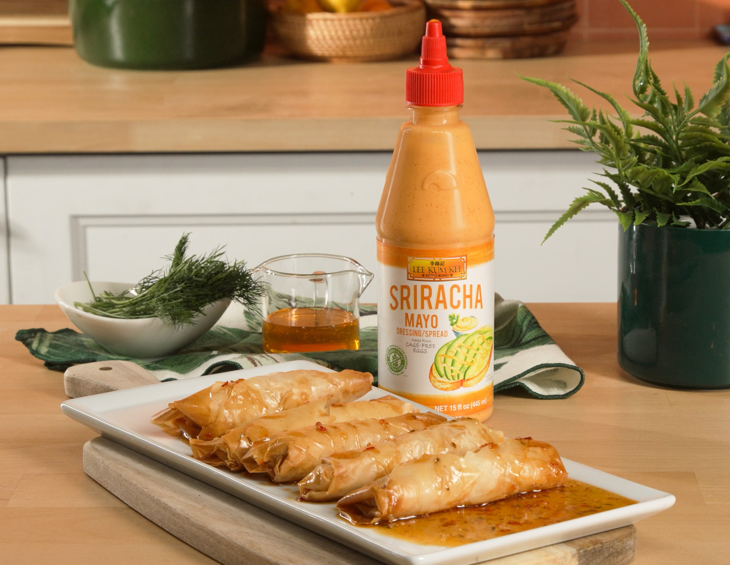 Five feta rolls with hot honey sauce and Lee Kum Kee Sriracha Mayo, made from a delicious feta rolls recipe.