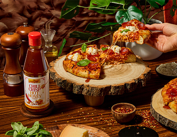 A focaccia pizza recipe drizzled with chili crisp hot honey.