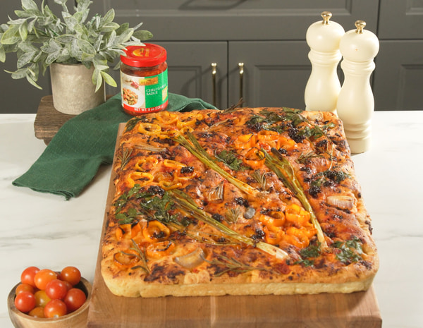 A vibrant garden focaccia recipe made with Lee Kum Kee chili sauces.