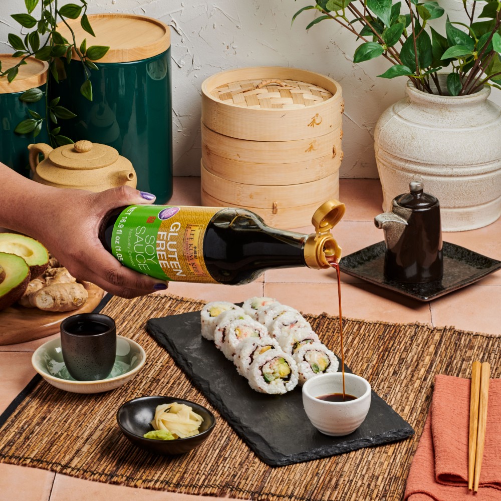 Lee Kum Kee Gluten Free Soy Sauce poured into a serving dish for dipping California roll sushi into.