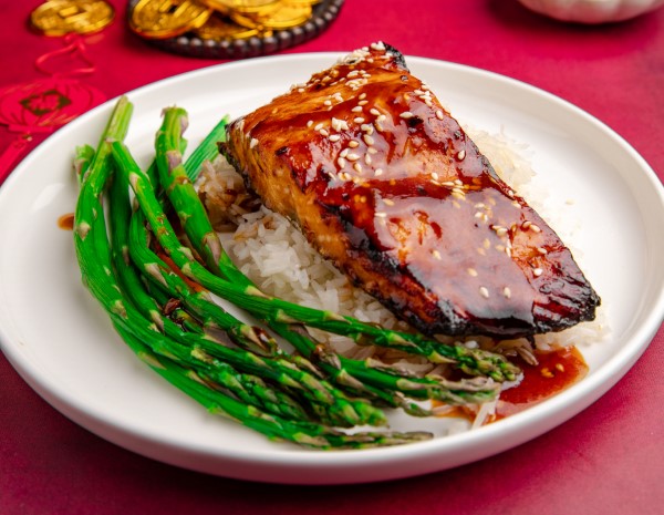 A glazed salmon bowl recipe representing prosperity in the New Year.