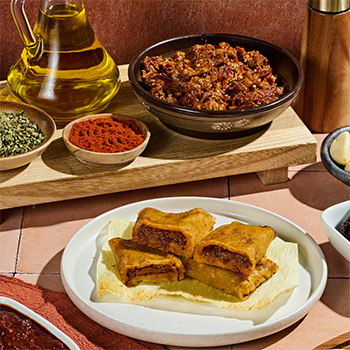 A spicy red chile pork tamales recipe for the holidays.