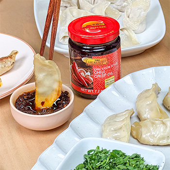 A set of homemade dumplings to make for New Year with chili crisp oil for dipping.
