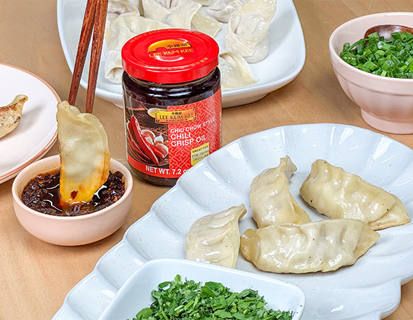 A set of homemade dumplings to make for New Year with chili crisp oil for dipping.