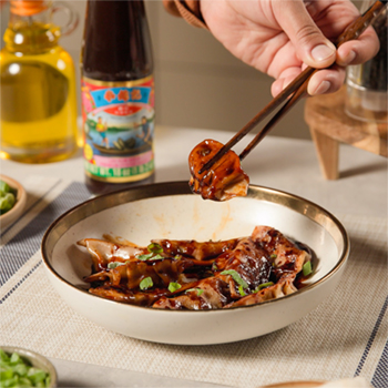 A homemade dumplings recipe cooked in a Filipino style chicken adobo sauce.