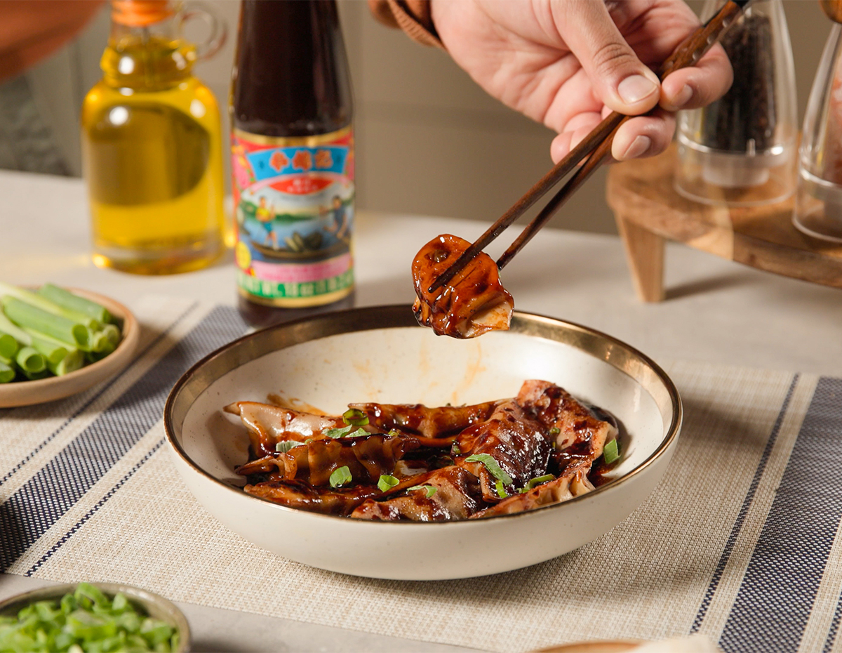 A homemade dumplings recipe cooked in a Filipino style chicken adobo sauce.