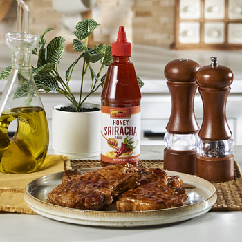 A honey sriracha pork chops recipe with Lee Kum Kee Honey Sriracha.