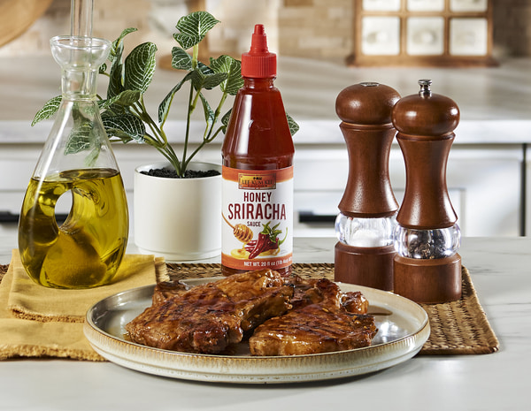 A honey sriracha pork chops recipe with Lee Kum Kee Honey Sriracha.