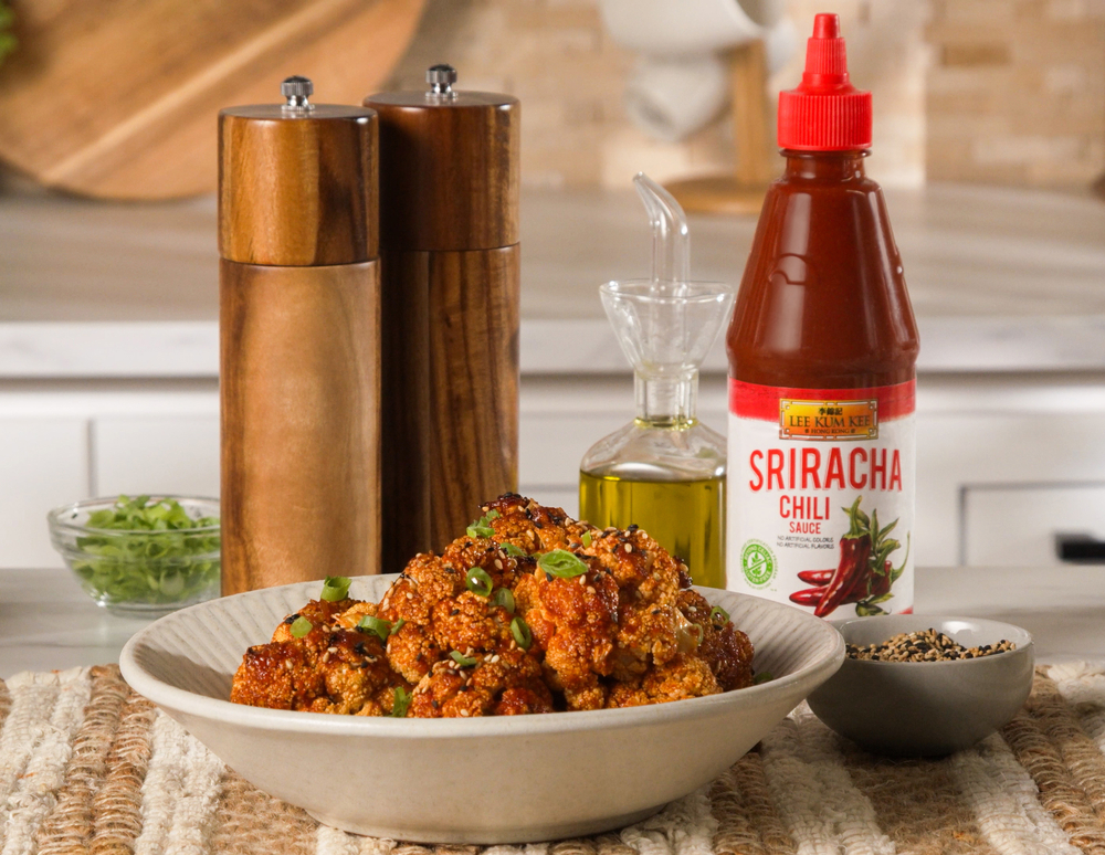 Baked Korean Style Cauliflower recipe, coated in a sauce spiced up with Lee Kum Kee Sriracha Chili Sauce.