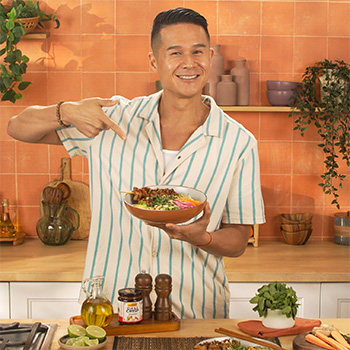 A lemongrass chicken skewers recipe in a vermicelli bowl by Chef Charles Chen.