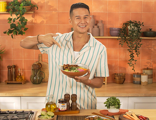 A lemongrass chicken skewers recipe in a vermicelli bowl by Chef Charles Chen.